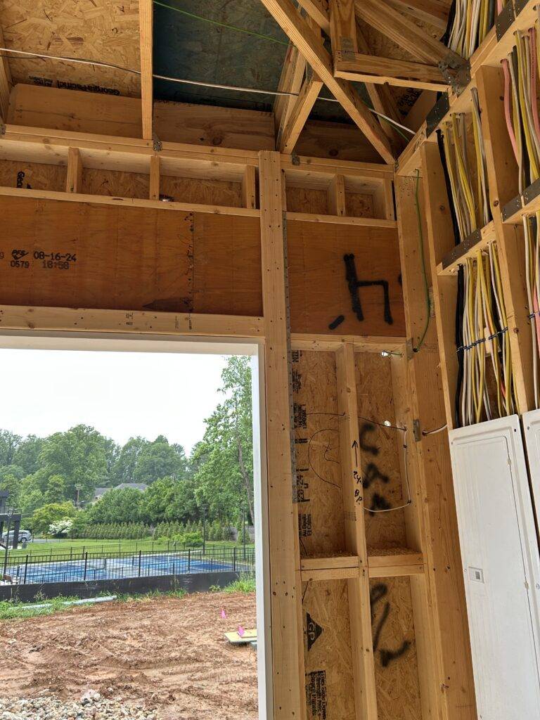 Structured-wiring connection center installed by Best Integrated Systems in a garage, with labeled terminations