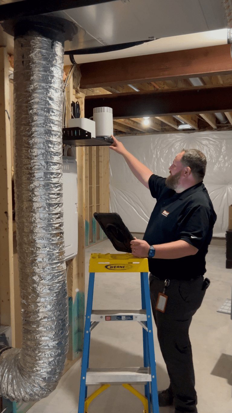 Best Integrated Systems crew during a basement walkthrough at a job site