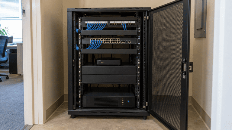 Neatly dressed commercial server rack and patch panels in IT room